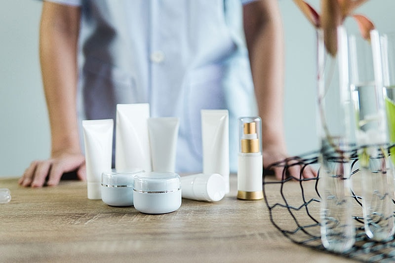 Skincare products on a wooden table.