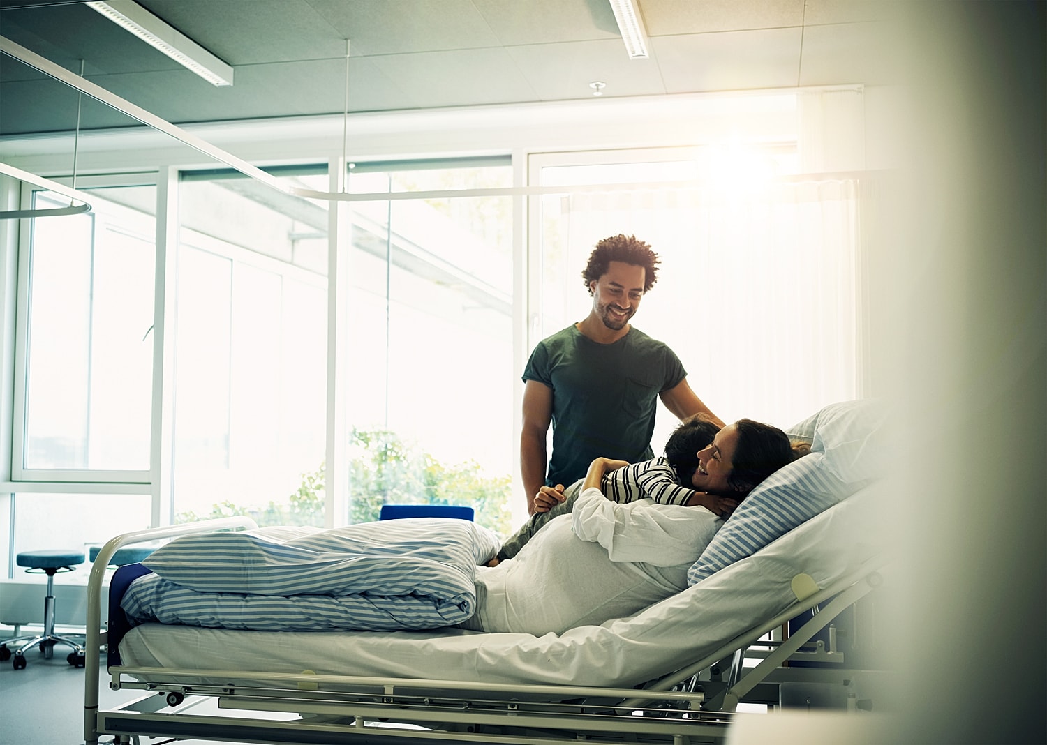 Family visit in a hospital room.